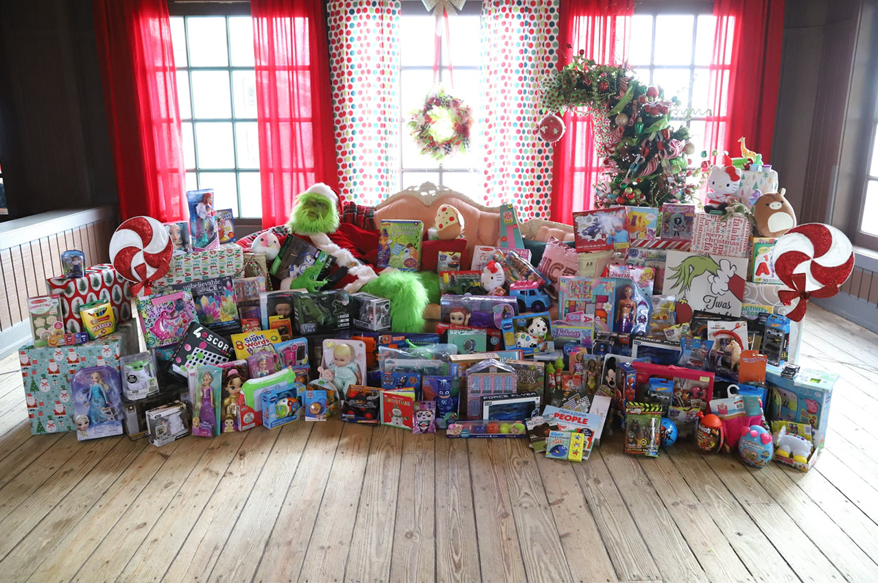 Grinch truck delivers holiday cheer and hope to the QCA 